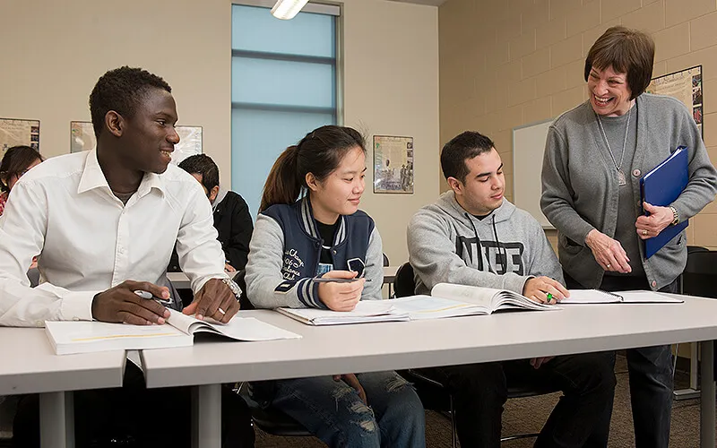 Instructor engaging with students in classroom.