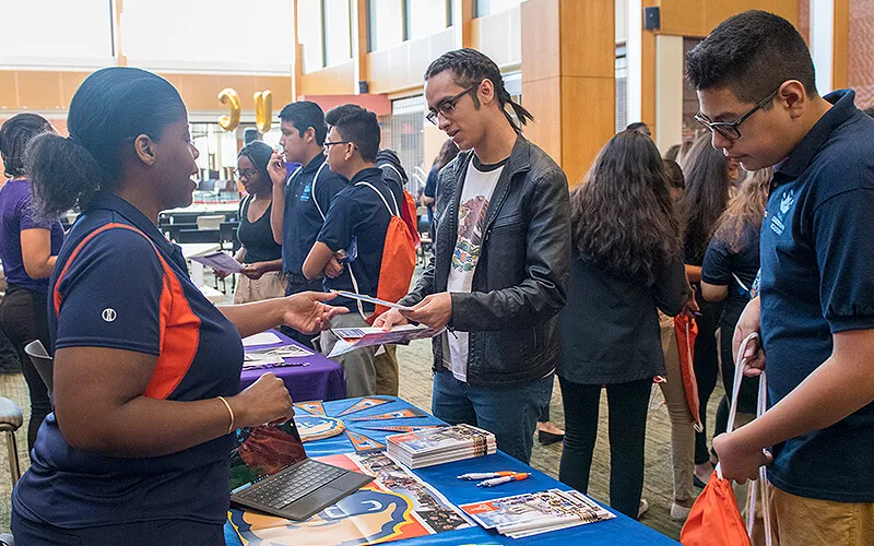 Young men and women attending the HBCU Fair.