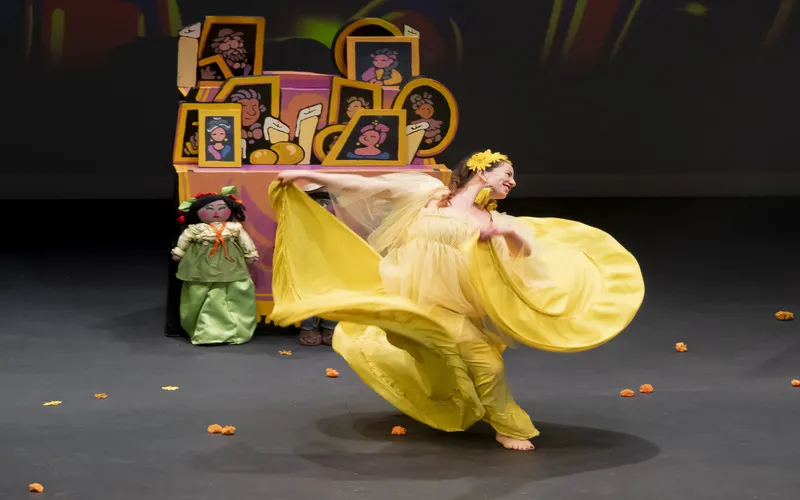 A performer dances during the production of 