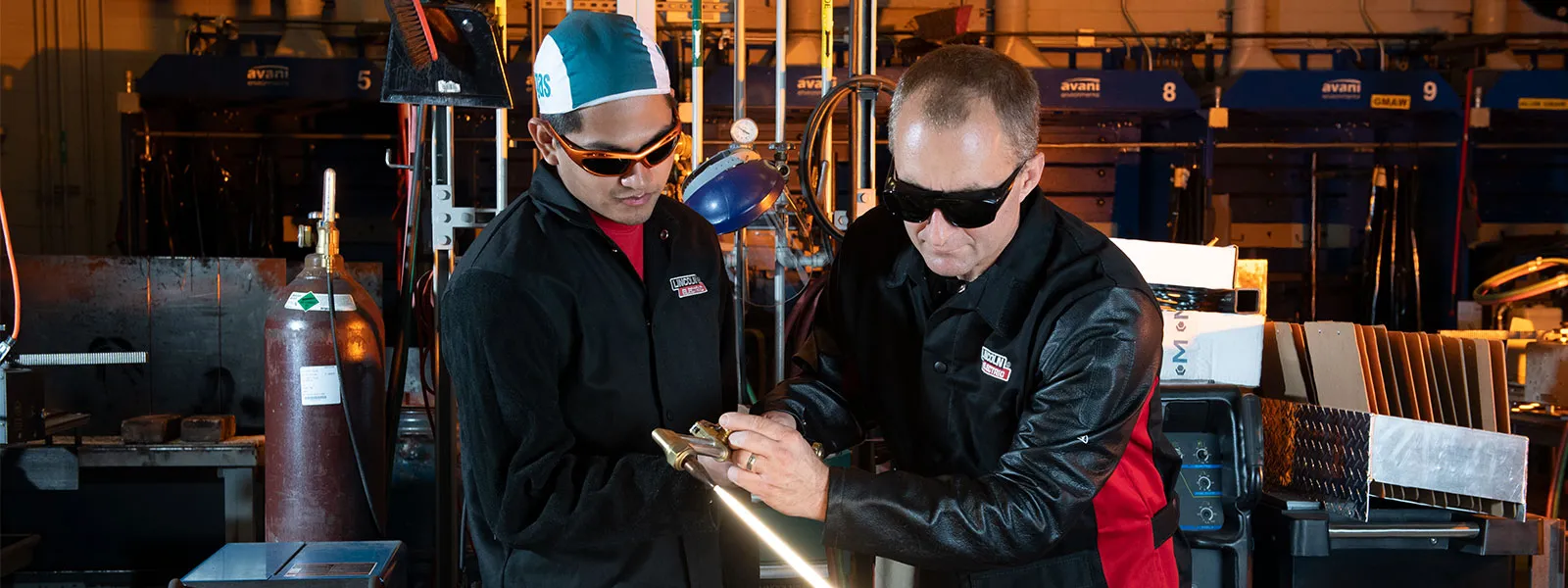 Instructor works with a student bringing real-world welding experience in the on-campus lab.