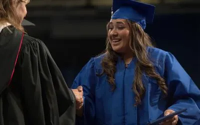 An HSE student receives a diploma