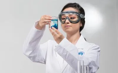 Aimee Padilla looks at a science beaker