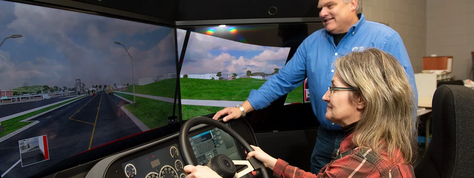 Image of student and instructor using simulator