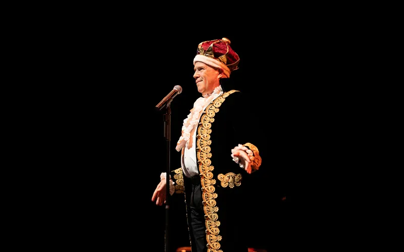 Club Cabaret actor performs on stage.