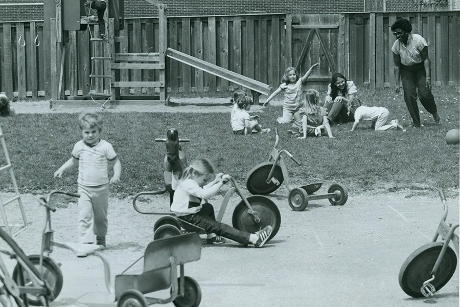 children riding tricycles