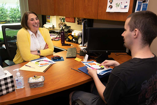 Mentor talking to student