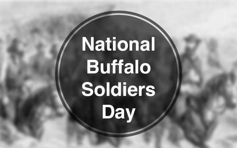 Graphic reading &ldquo;National Buffalo Soldiers Day&rdquo; over a blurred historical image of soldiers on horseback.